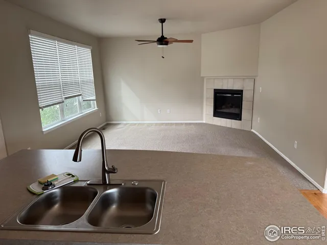 a close view of sink a faucet and appliance in the kitchen