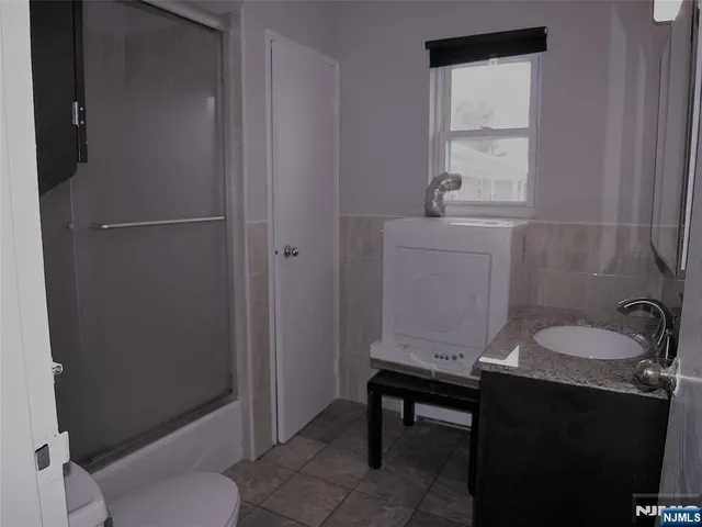 a bathroom with a sink toilet and tub