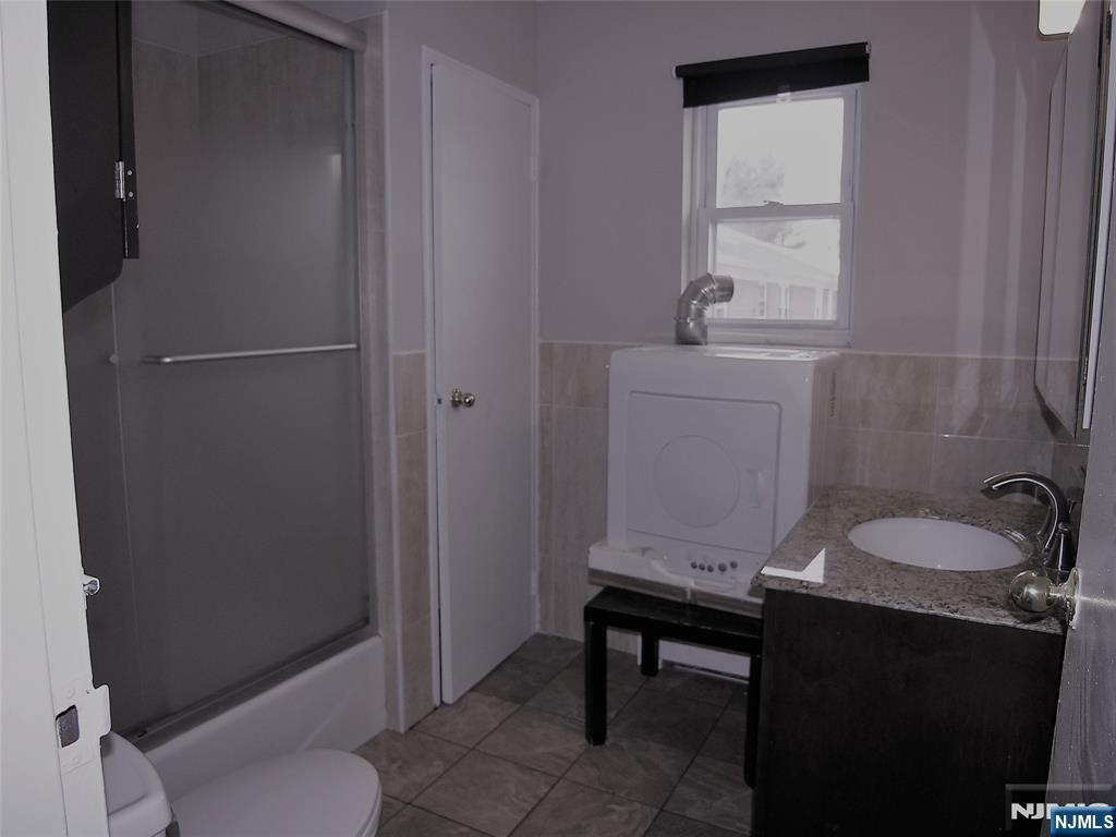 1143 Valley Road, Unit 30 Wayne, NJ 07470 - Photo 17 of 17 a bathroom with a sink toilet and tub