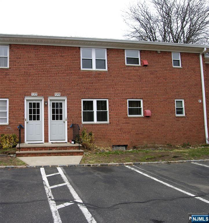 1143 Valley Road, Unit 30 Wayne, NJ 07470 - Photo 3 of 17 a view of a house with a yard