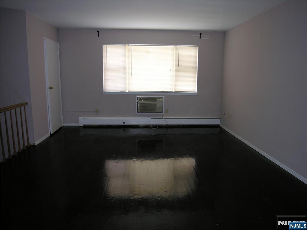 1143 Valley Road, Unit 30 Wayne, NJ 07470 - Photo 9 of 17 a view of a room with wooden floor and a window