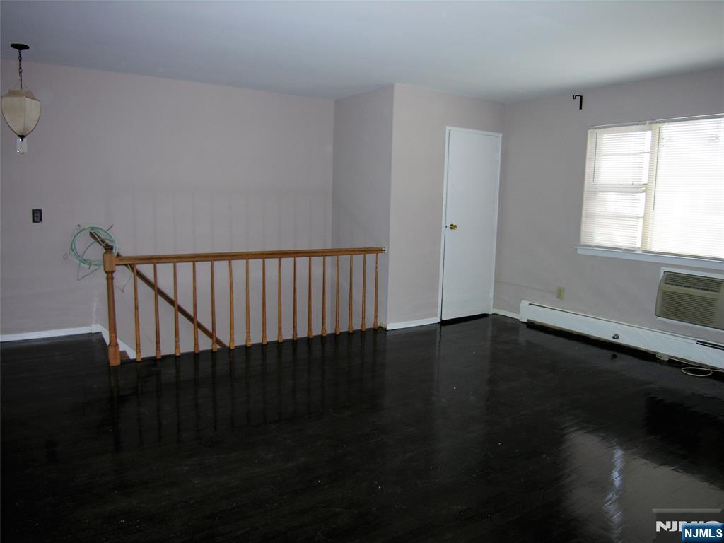 1143 Valley Road, Unit 30 Wayne, NJ 07470 - Photo 10 of 17 a view of a hallway with wooden floor and a window