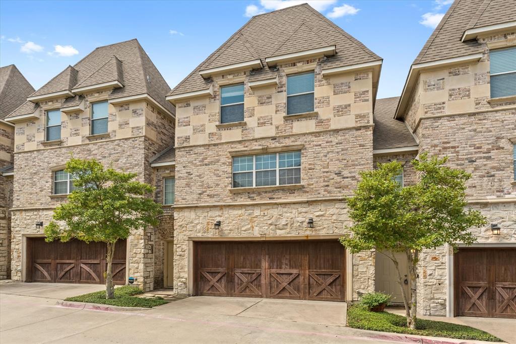 2700 Club Ridge Drive, Unit 9 Lewisville, TX 75067 - Photo 1 of 1 a front view of a house with garage