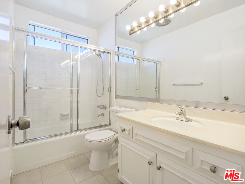 1538 11th, Unit 3 Santa Monica, CA 90401 - Photo 5 of 6 a bathroom with a sink a toilet and shower
