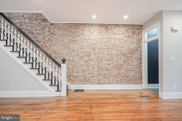 a view of entryway with wooden floor