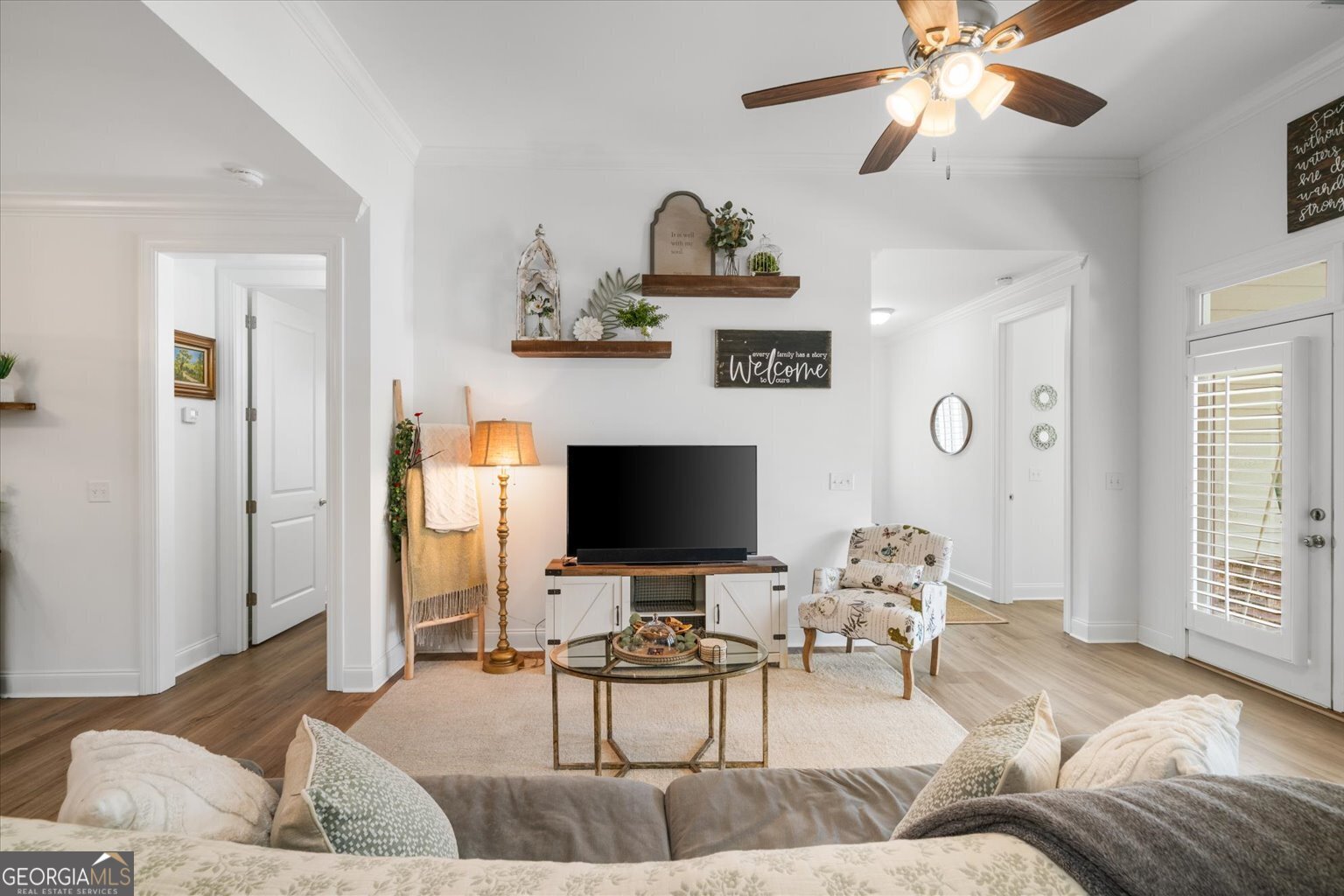 383 Pacer Lane, Unit 3 Dalton, GA 30721 - Photo 8 of 50 a living room with furniture and a flat screen tv