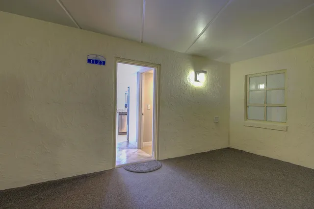 an empty room with windows