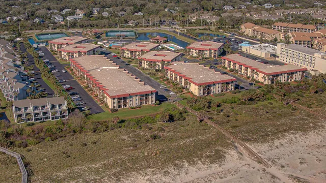 an aerial view of residential houses with outdoor space