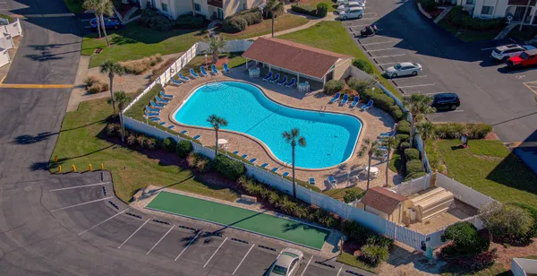 a view of a backyard with chairs