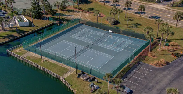 an aerial view of a house with a garden