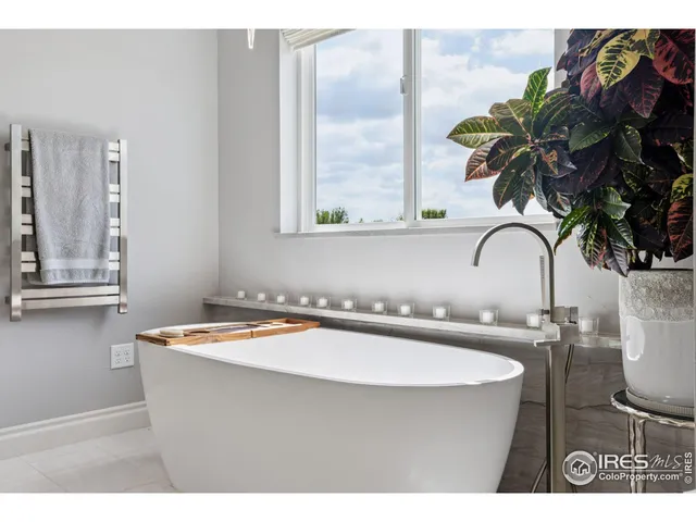 a room with a sink and a potted plant