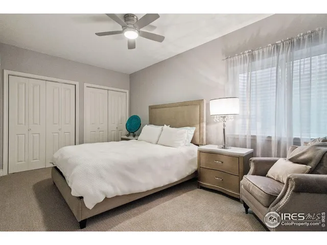 a bedroom with bed and window