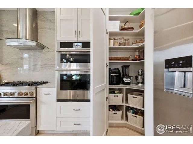 a kitchen with stainless steel appliances and cabinets