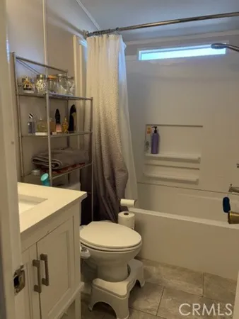 a bathroom with a toilet and shower