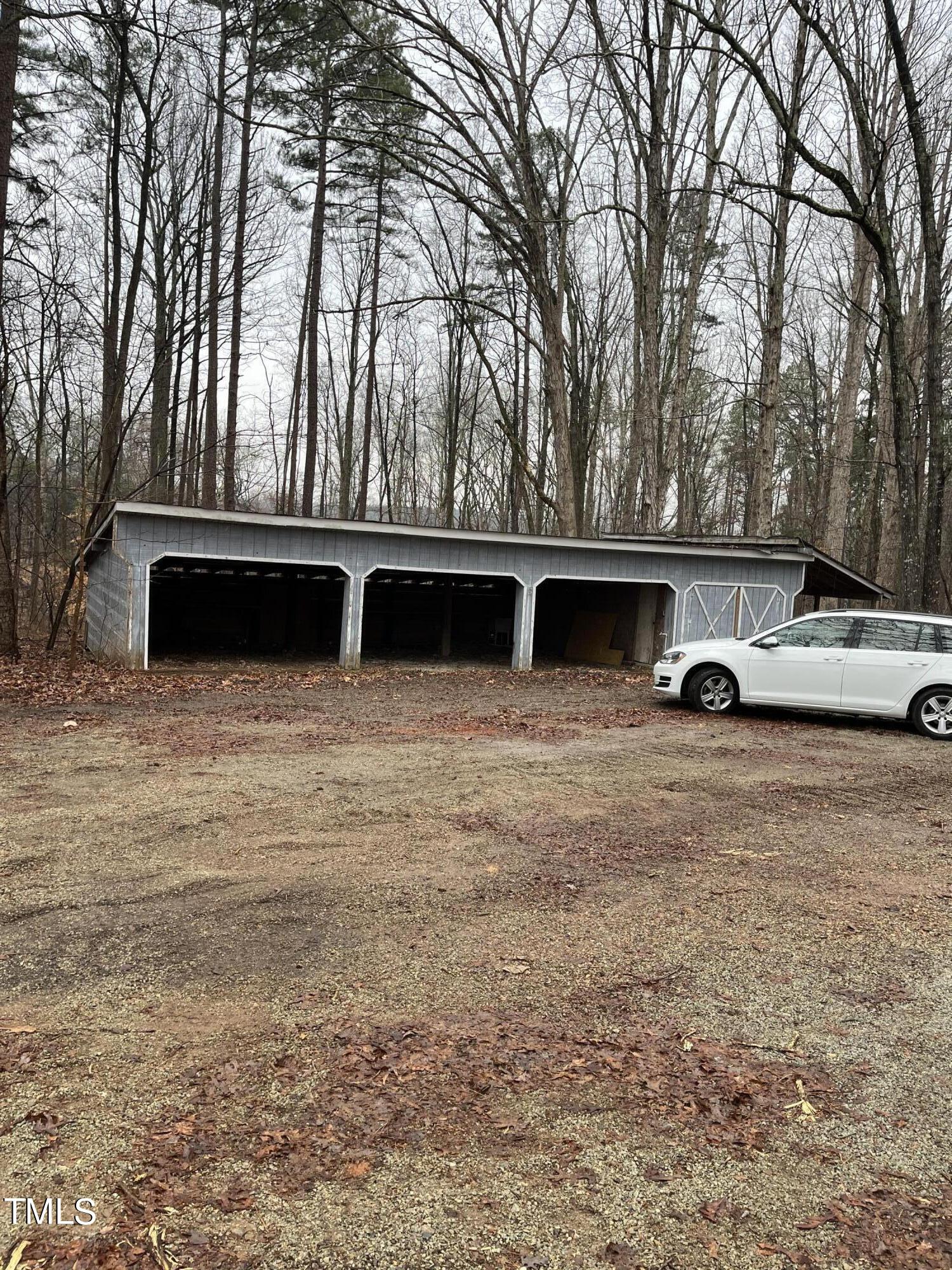 8017 Bunny Road Rougemont, NC 27572 - Photo 2 of 11 a view of outdoor space with deck and tree