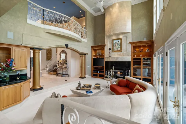 a view of a dining room with furniture and chandelier