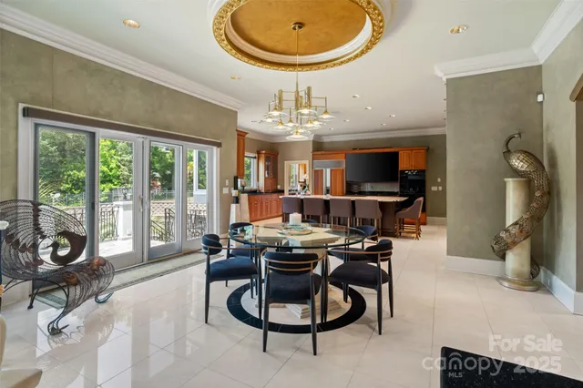 a work room with furniture and a large window