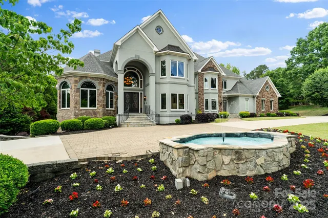 a front view of a house with swimming pool