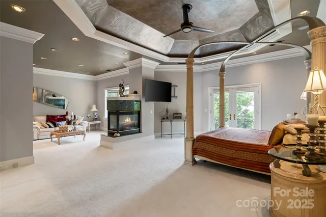 a bedroom with furniture and a fireplace