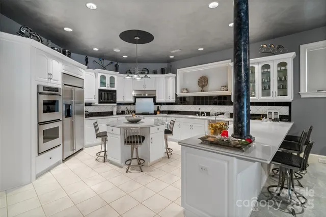 a kitchen with a stove a sink and a refrigerator