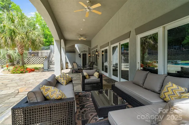 a view of a swimming pool with a patio