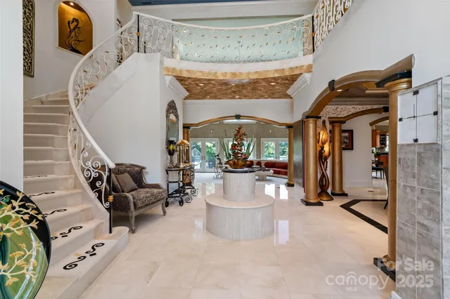 a view of living room next to a couch