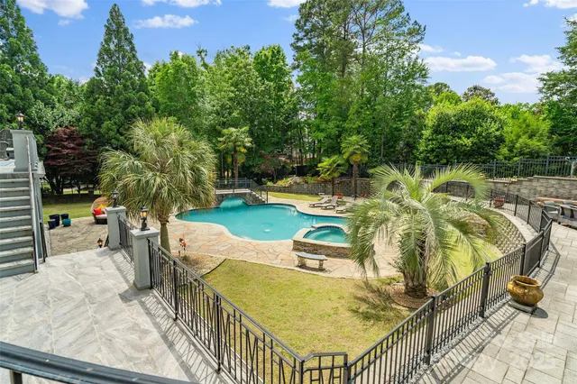 a view of a swimming pool with a patio