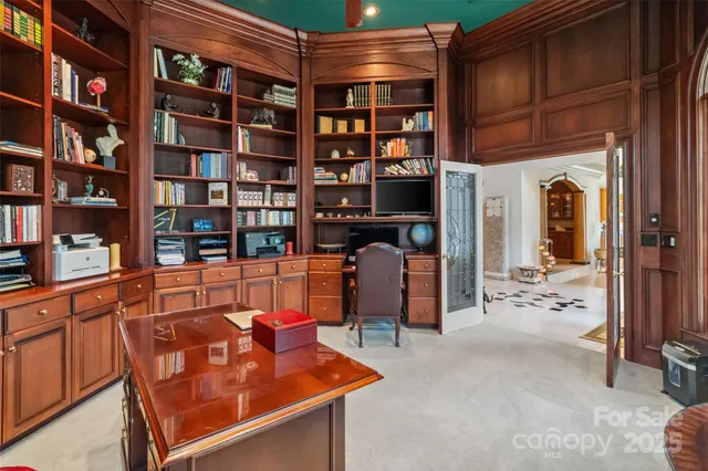 a view of a living room and workspace