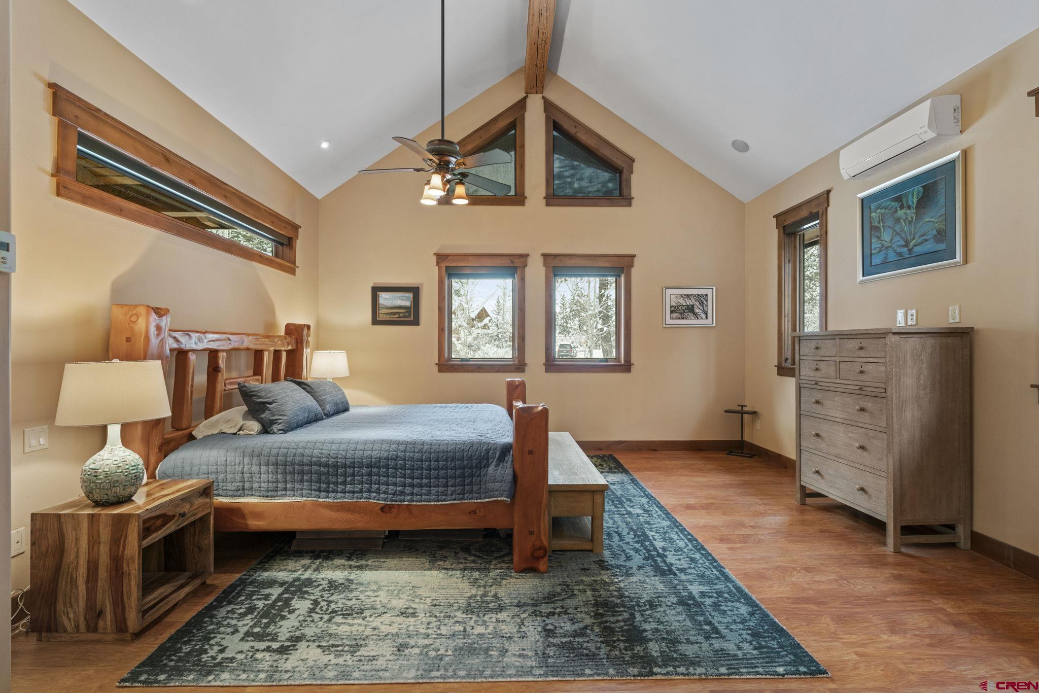 680 The Golden Dipper Road Durango, CO 81301 - Photo 13 of 35 a bedroom with double bed a dresser and a window
