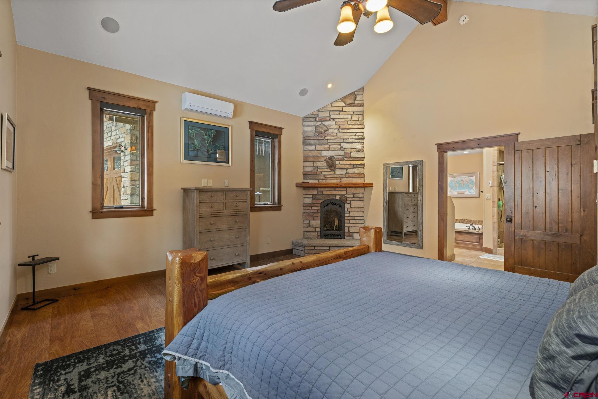 680 The Golden Dipper Road Durango, CO 81301 - Photo 14 of 35 a bedroom with bed and window