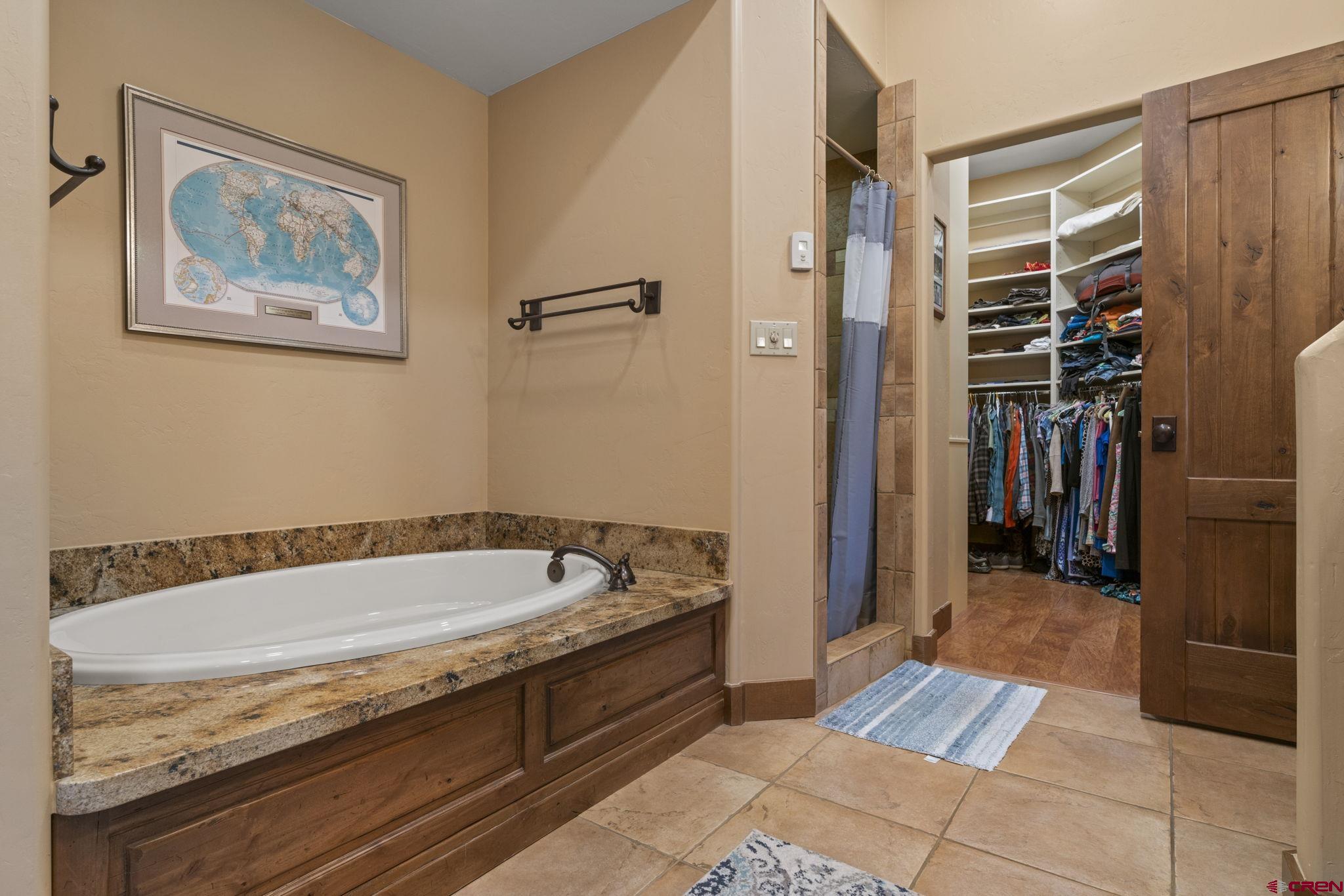 680 The Golden Dipper Road Durango, CO 81301 - Photo 17 of 35 a bathroom with a tub and shower