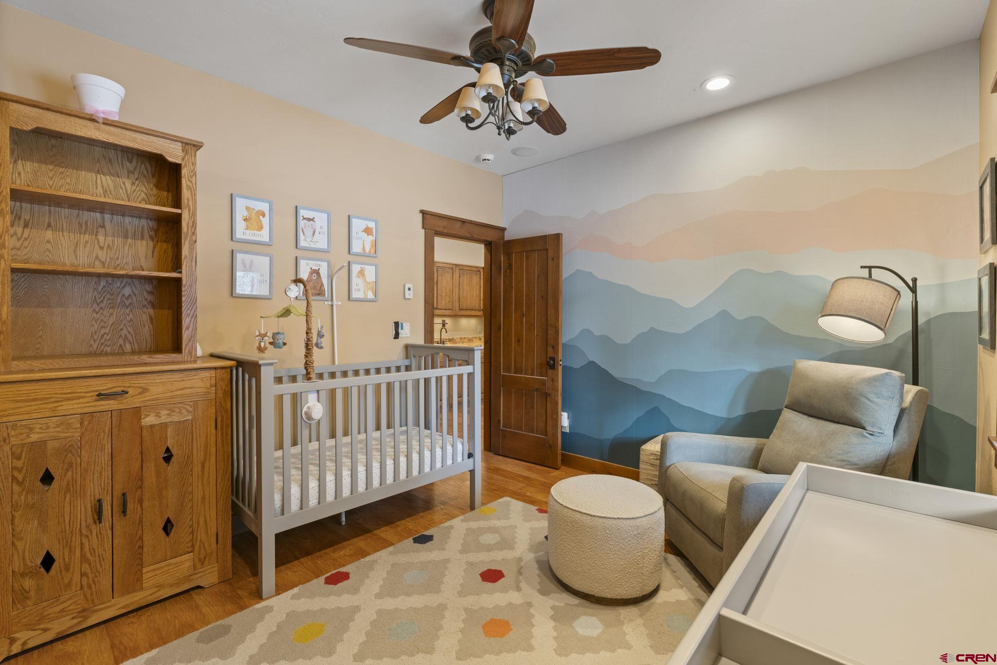 680 The Golden Dipper Road Durango, CO 81301 - Photo 30 of 35 a bedroom with furniture and a window