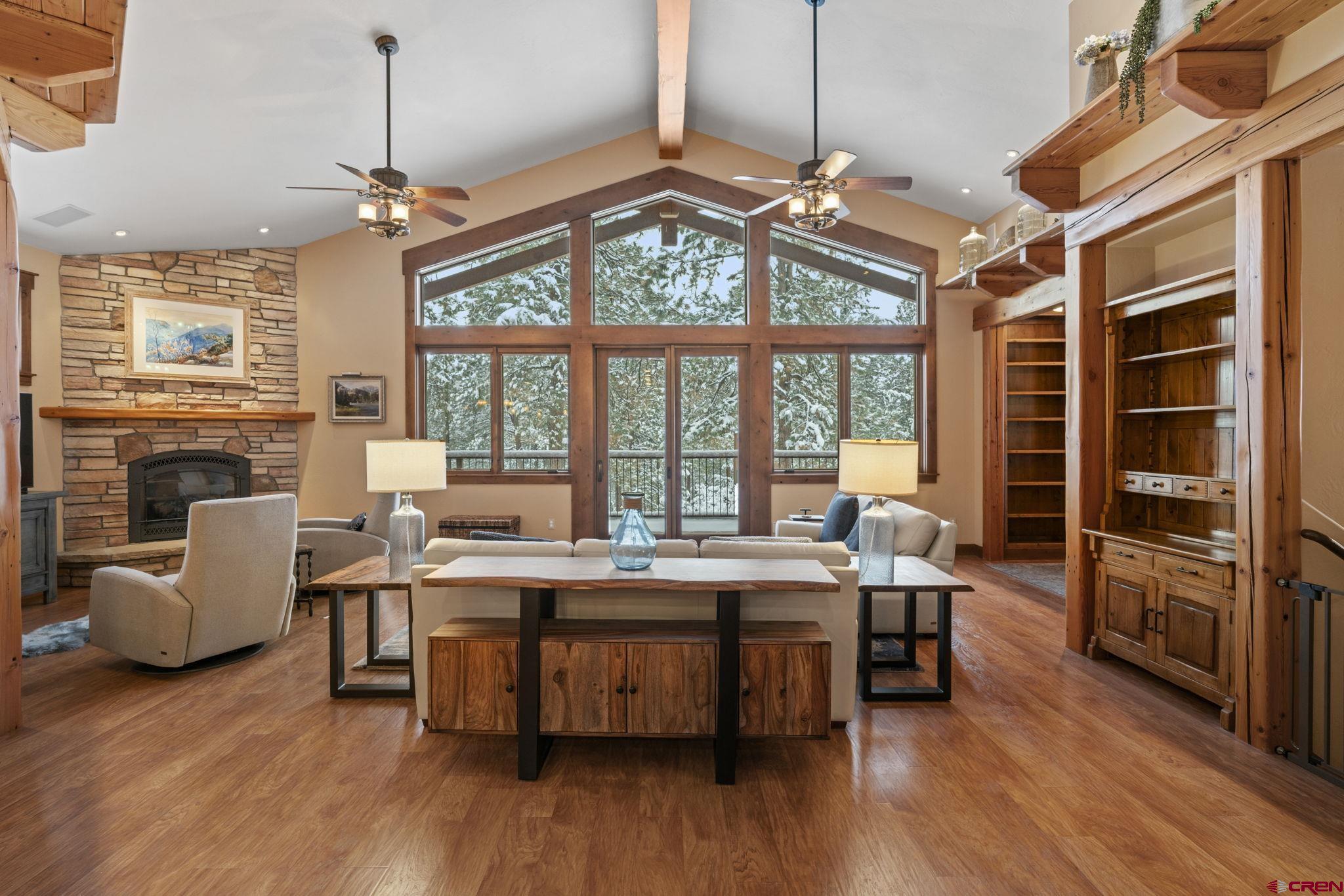 680 The Golden Dipper Road Durango, CO 81301 - Photo 3 of 35 a view of a livingroom with furniture window and wooden floor