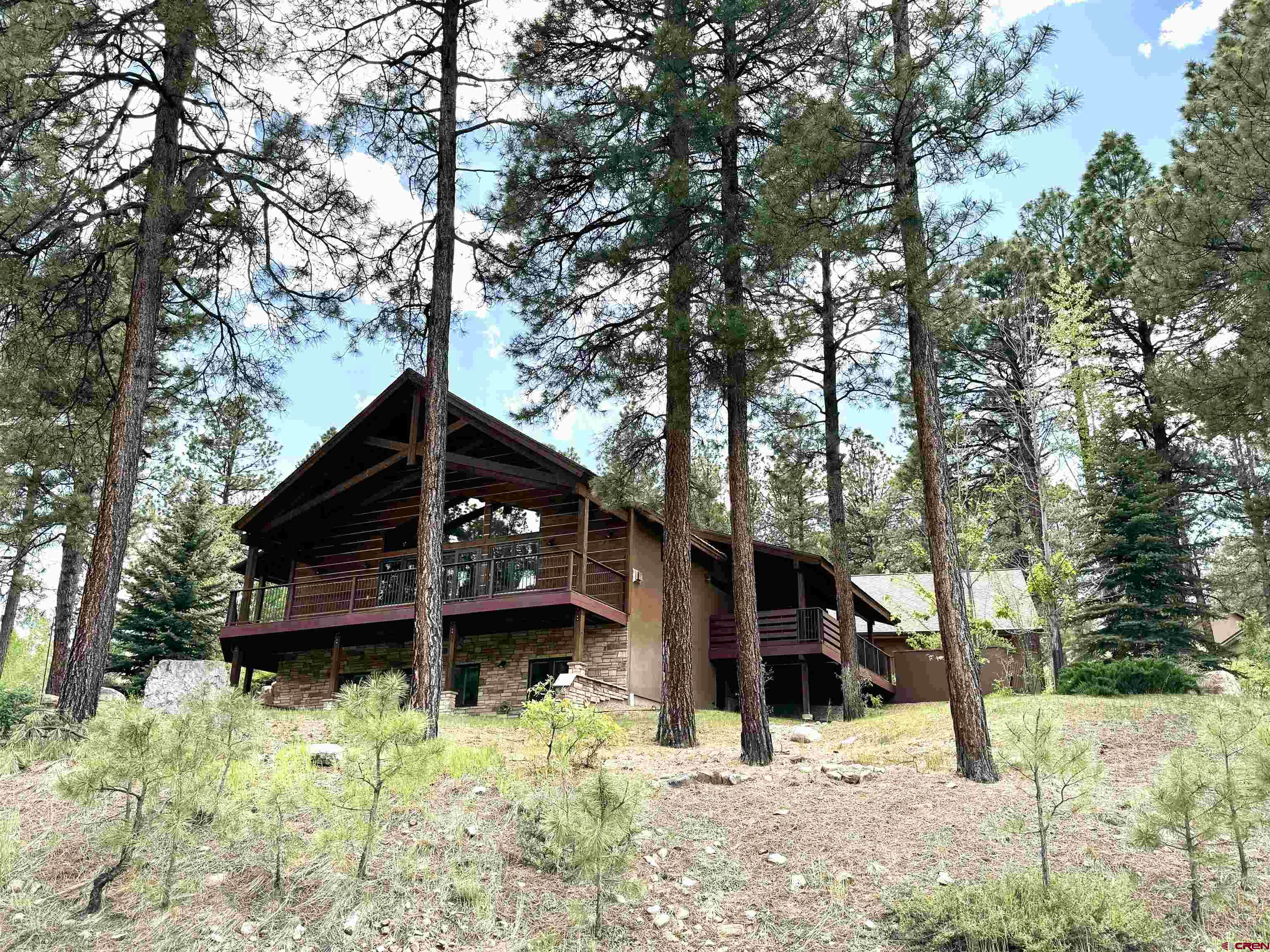 680 The Golden Dipper Road Durango, CO 81301 - Photo 33 of 35 a front view of a house with a yard