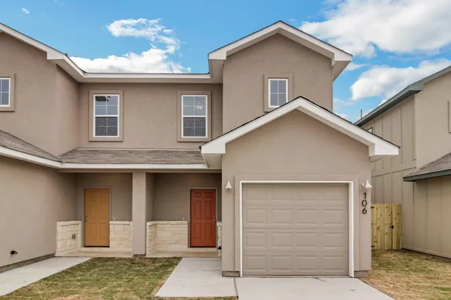 a view of a house with a garage