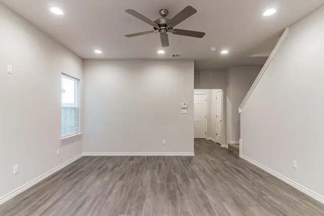 a view of a livingroom with wooden floor