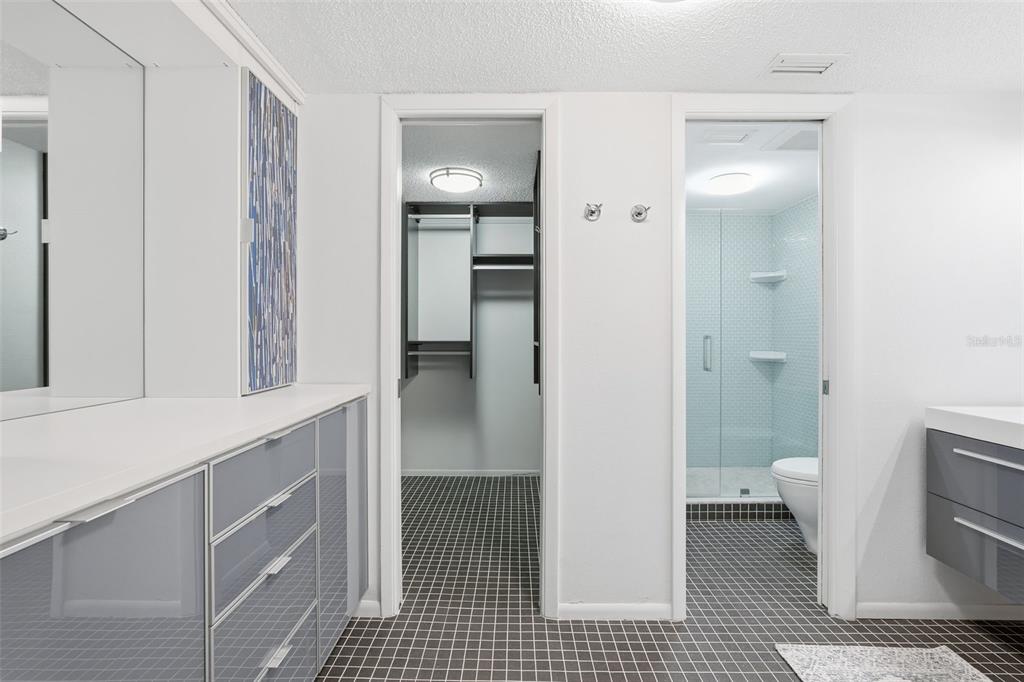 6415 Midnight Pass Road, Unit 211 Sarasota, FL 34242 - Photo 25 of 58 a bathroom with a sink and a toilet