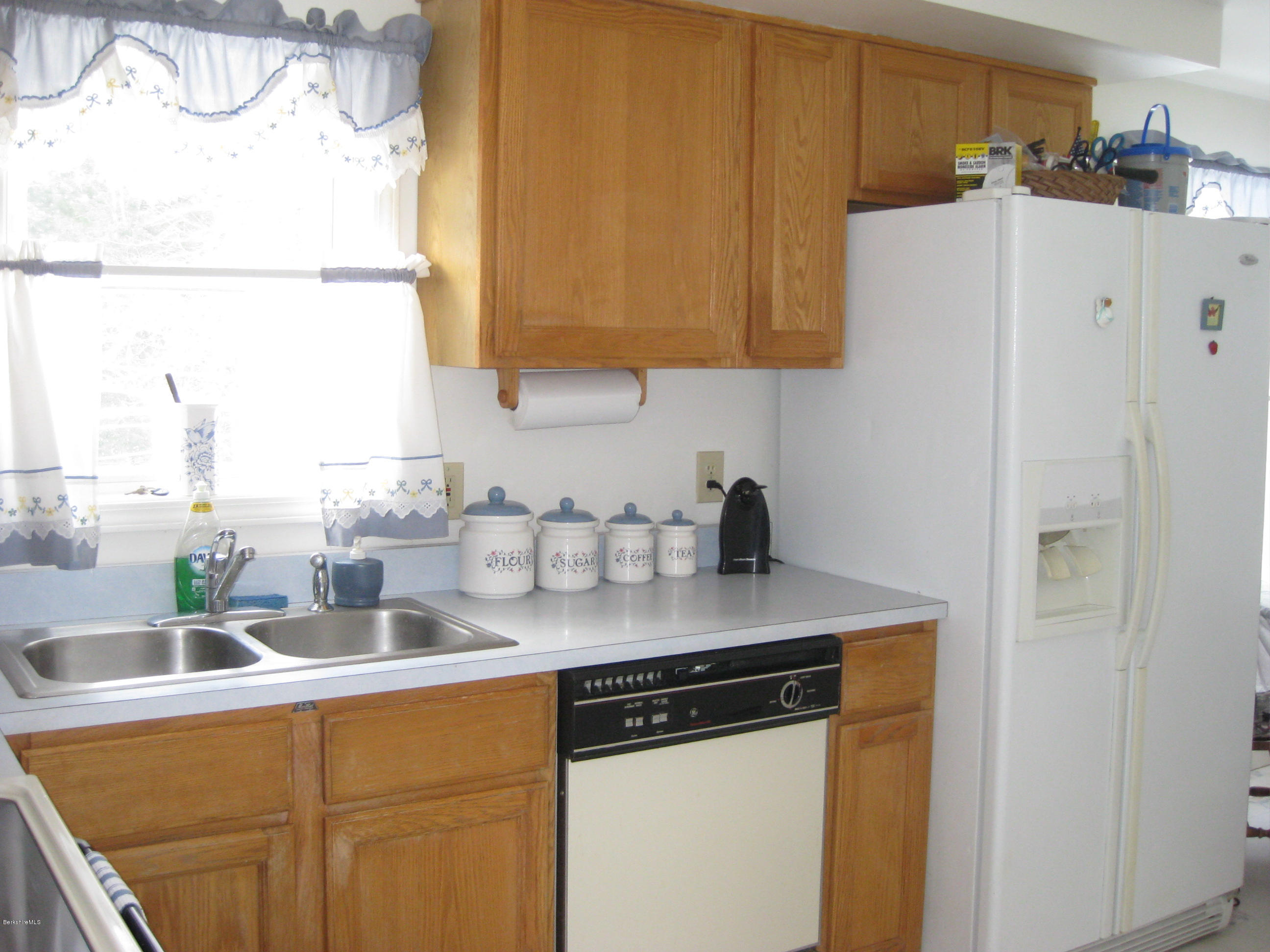 576 Loop Road Savoy, MA 01256 - Photo 3 of 23 a kitchen with stainless steel appliances granite countertop a sink a stove and a refrigerator with wooden floor