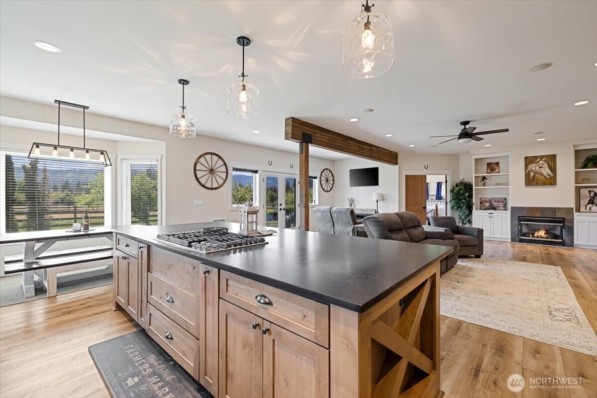 644 Masterson Road Cle Elum, WA 98922 - Photo 16 of 40 an open kitchen with a table and chairs in it