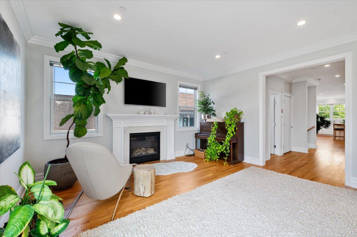 545 East Fulton Street Long Beach, NY 11561 - Photo 18 of 41 Living room with wood finished floors, a fireplace, crown molding, and recessed lighting