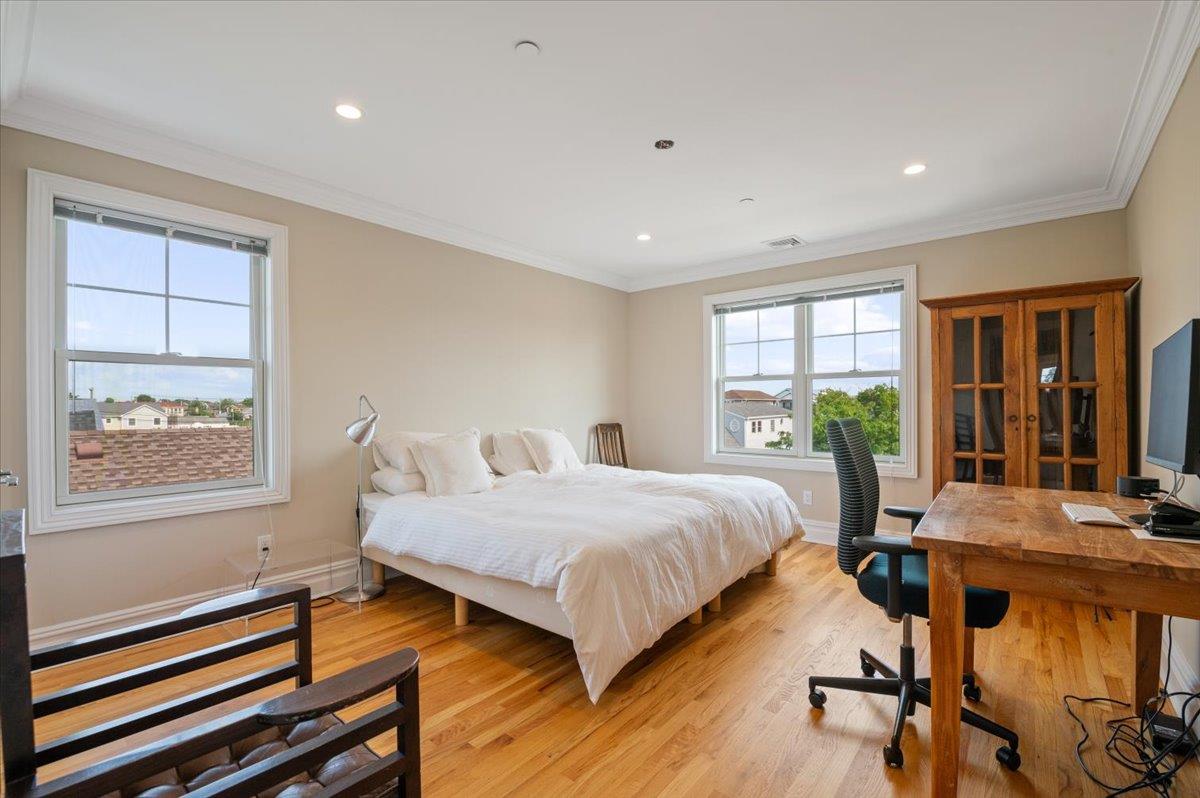 545 East Fulton Street Long Beach, NY 11561 - Photo 20 of 41 Bedroom with light wood-type flooring, an office area, recessed lighting, and ornamental molding
