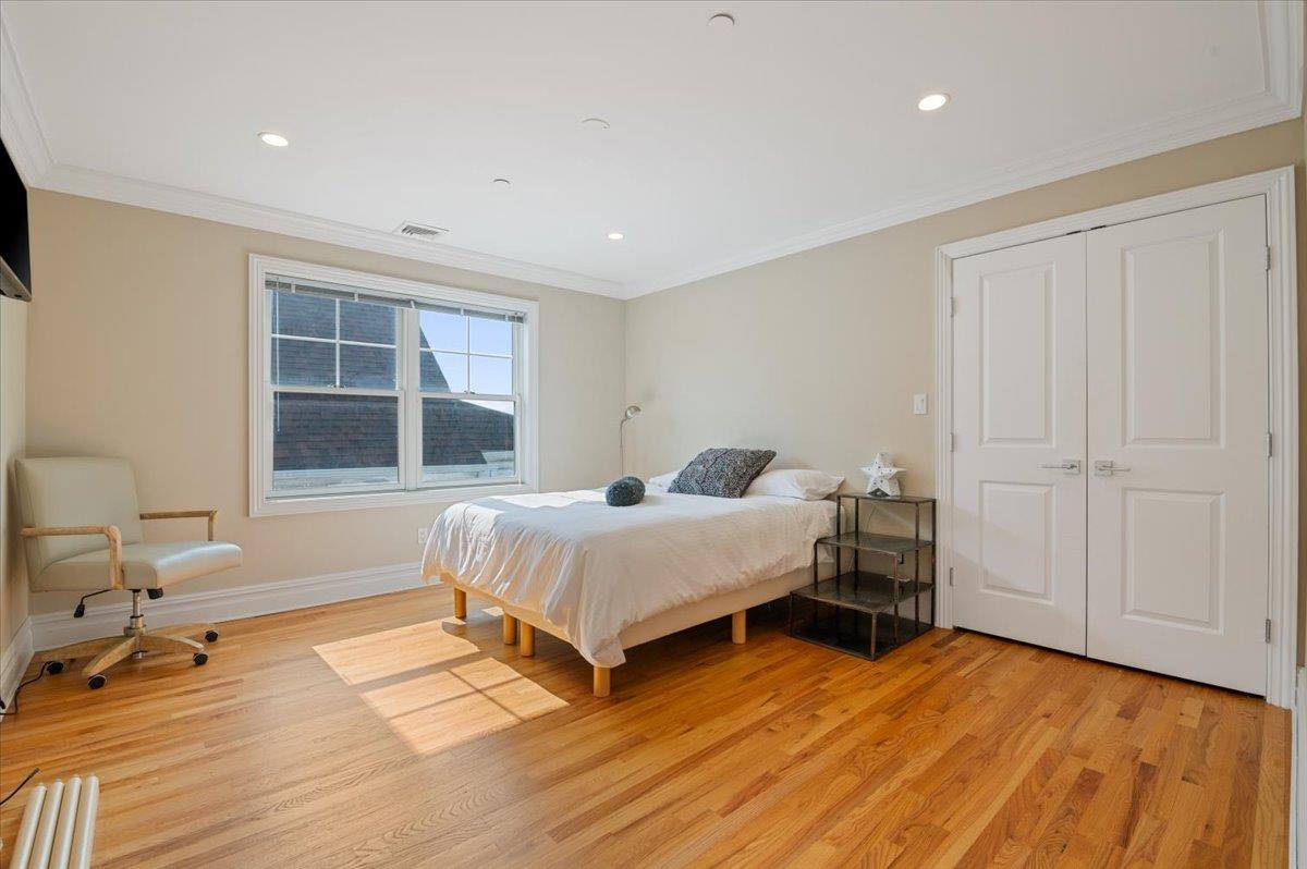 545 East Fulton Street Long Beach, NY 11561 - Photo 21 of 41 Bedroom with light wood finished floors, crown molding, recessed lighting, and a closet