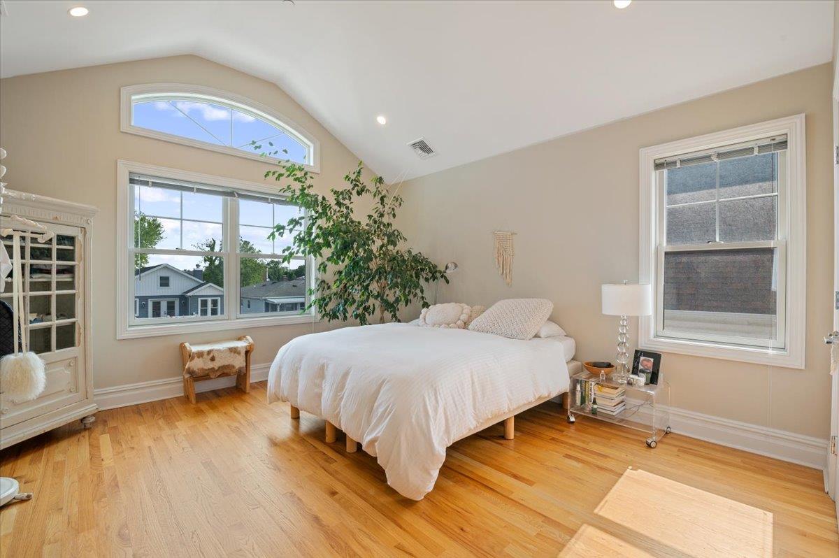 545 East Fulton Street Long Beach, NY 11561 - Photo 23 of 41 Bedroom with lofted ceiling, light wood-type flooring, and recessed lighting