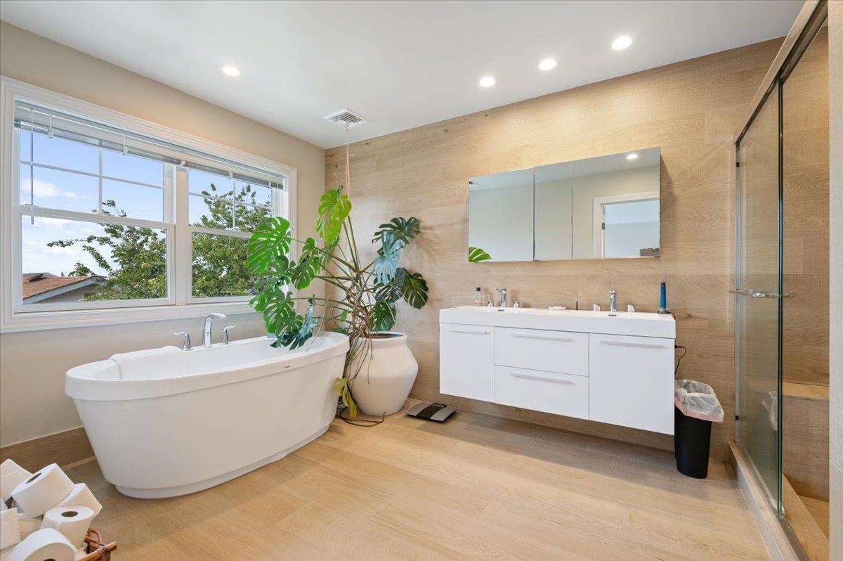 545 East Fulton Street Long Beach, NY 11561 - Photo 28 of 41 Full bath with double vanity, a freestanding tub, a stall shower, recessed lighting, and wood finished floors