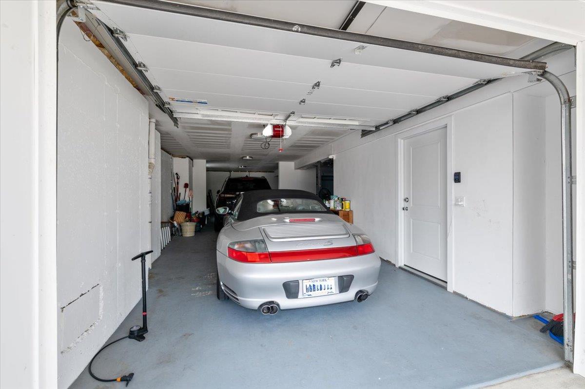 545 East Fulton Street Long Beach, NY 11561 - Photo 31 of 41 Garage featuring a garage door opener