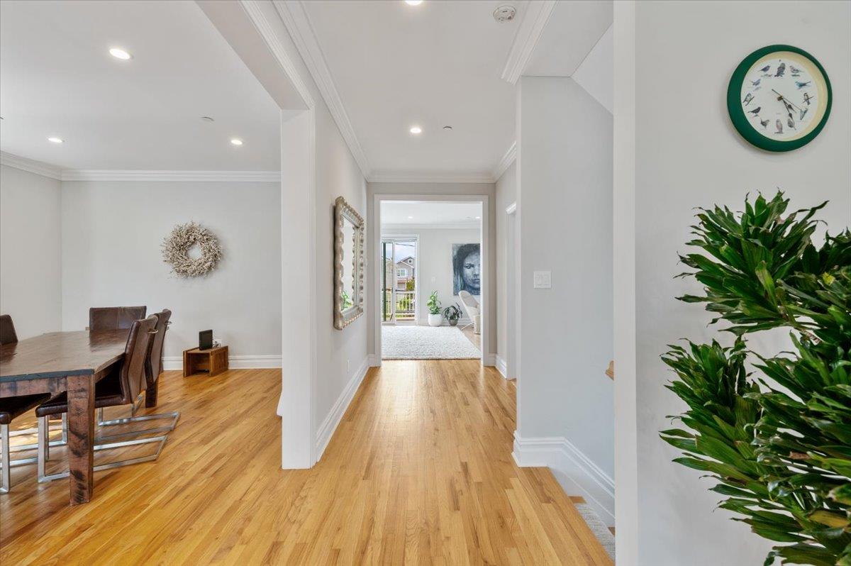 545 East Fulton Street Long Beach, NY 11561 - Photo 10 of 41 Hallway featuring light wood finished floors, recessed lighting, and crown molding