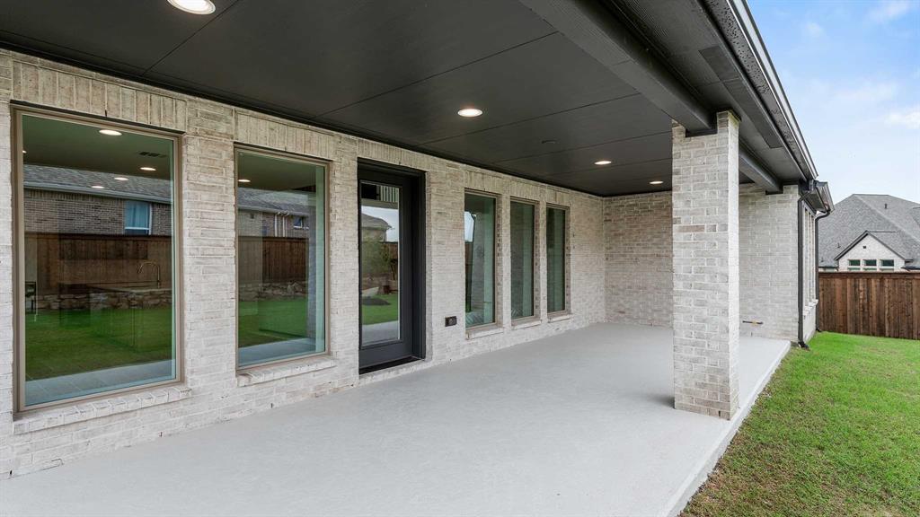 854 Stoney Bridge Way Lavon, TX 75166 - Photo 21 of 36 a view of a hallway with wooden floor and fence