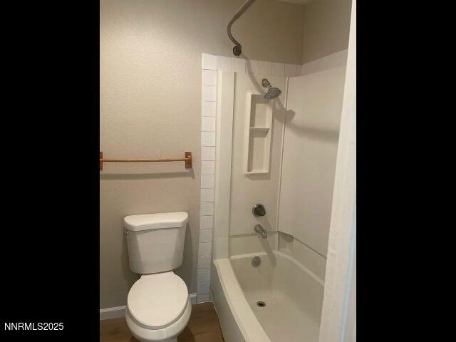 7680 Bluestone Drive, Unit 371 Reno, NV 89511 - Photo 7 of 14 a white toilet sitting next to a bath tub