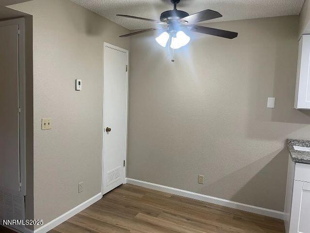 7680 Bluestone Drive, Unit 371 Reno, NV 89511 - Photo 10 of 14 a view of an empty room with wooden floor
