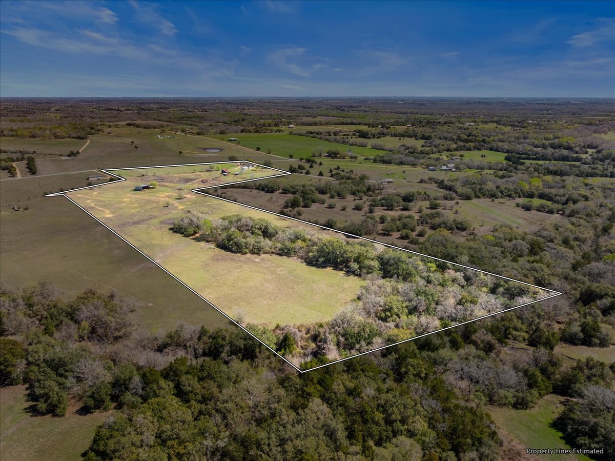 5079 Skull Creek Road Fayetteville, TX 78940 - Photo 15 of 15 a view of an ocean beach and mountain